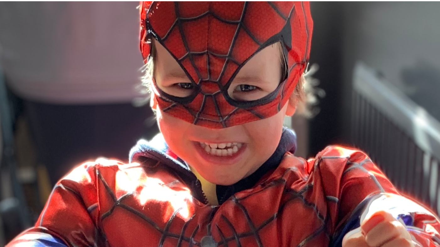 Hunter's Bar school pupil, Lars, dressed up in a Spider Man costume, with a cheeky grin on his face. 